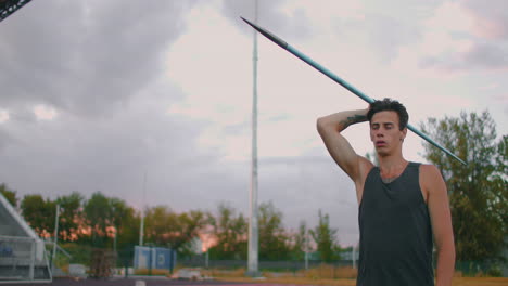 A-male-athlete-throws-javelins-at-a-stadium-in-slow-motion.-Athletics-javelin-throw-Olympic-program
